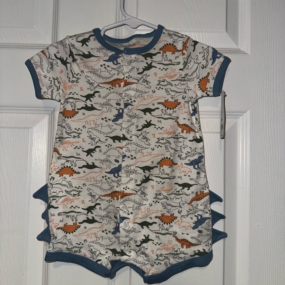 A blue white and orange dinosaur piece onesie. in the size 6 months.💙🧡⚪️